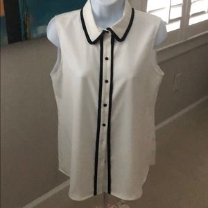 Elegant white blouse with black rivets